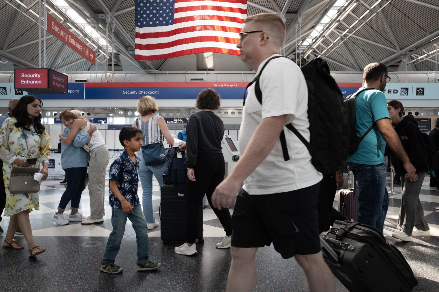 Passengers pass through O'Hare airport on July 03, 2024 in Chicago, Illinois
