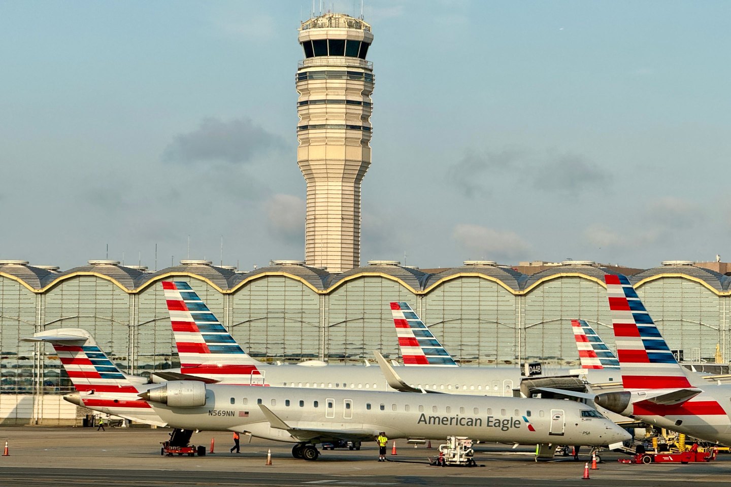American Airlines planes sits at gates at Ronald Reagan Washington National Airport in Arlington Virginia, on July 10, 2024.