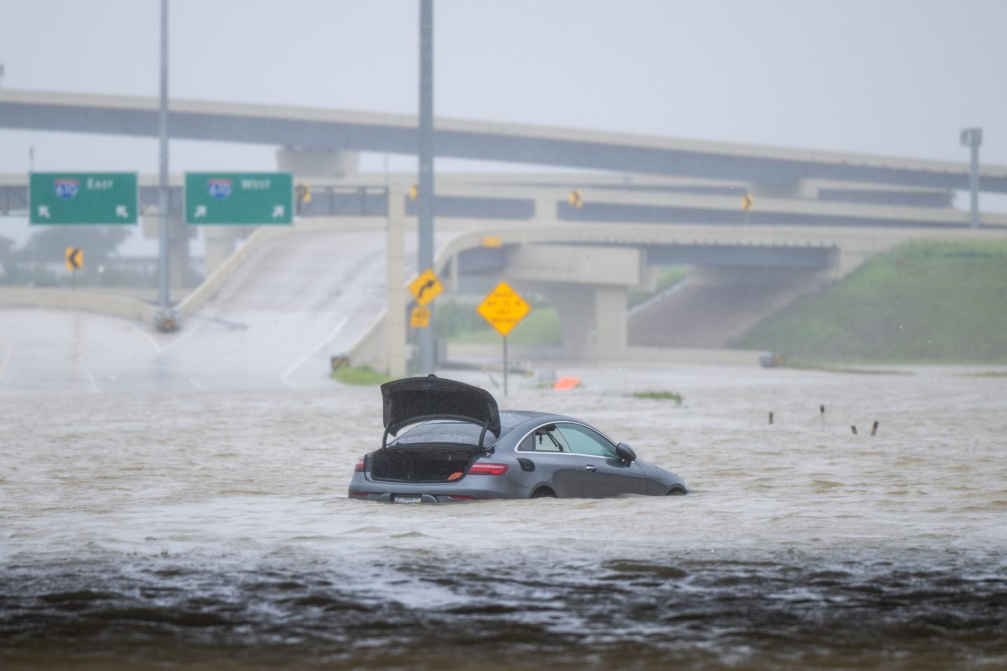 car submerged in flood water