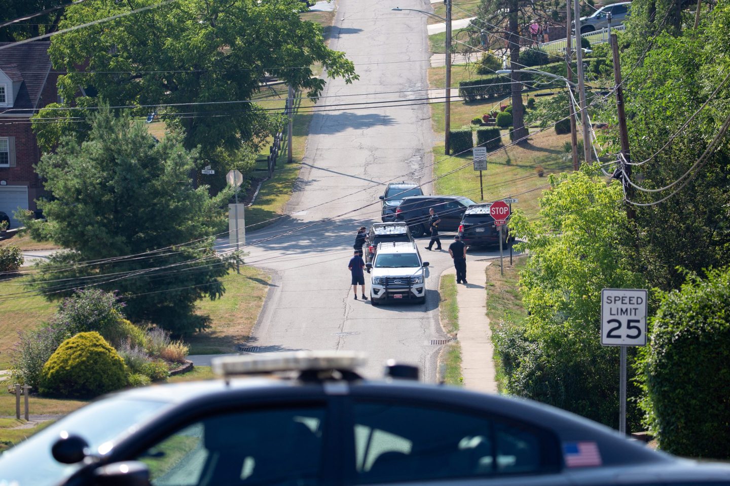 police and cars block intersection