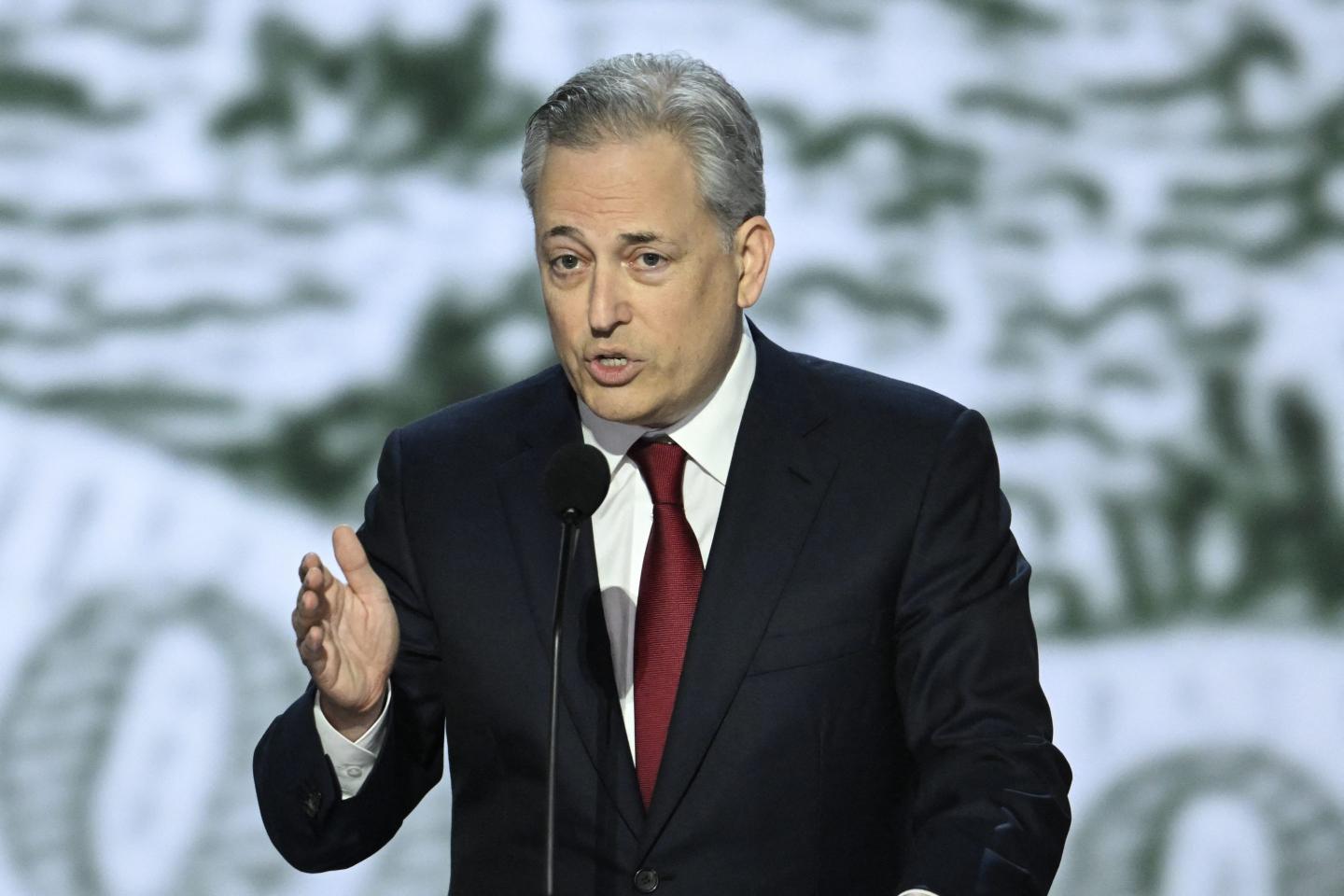 Venture capitalist David Sacks speaking at a podium