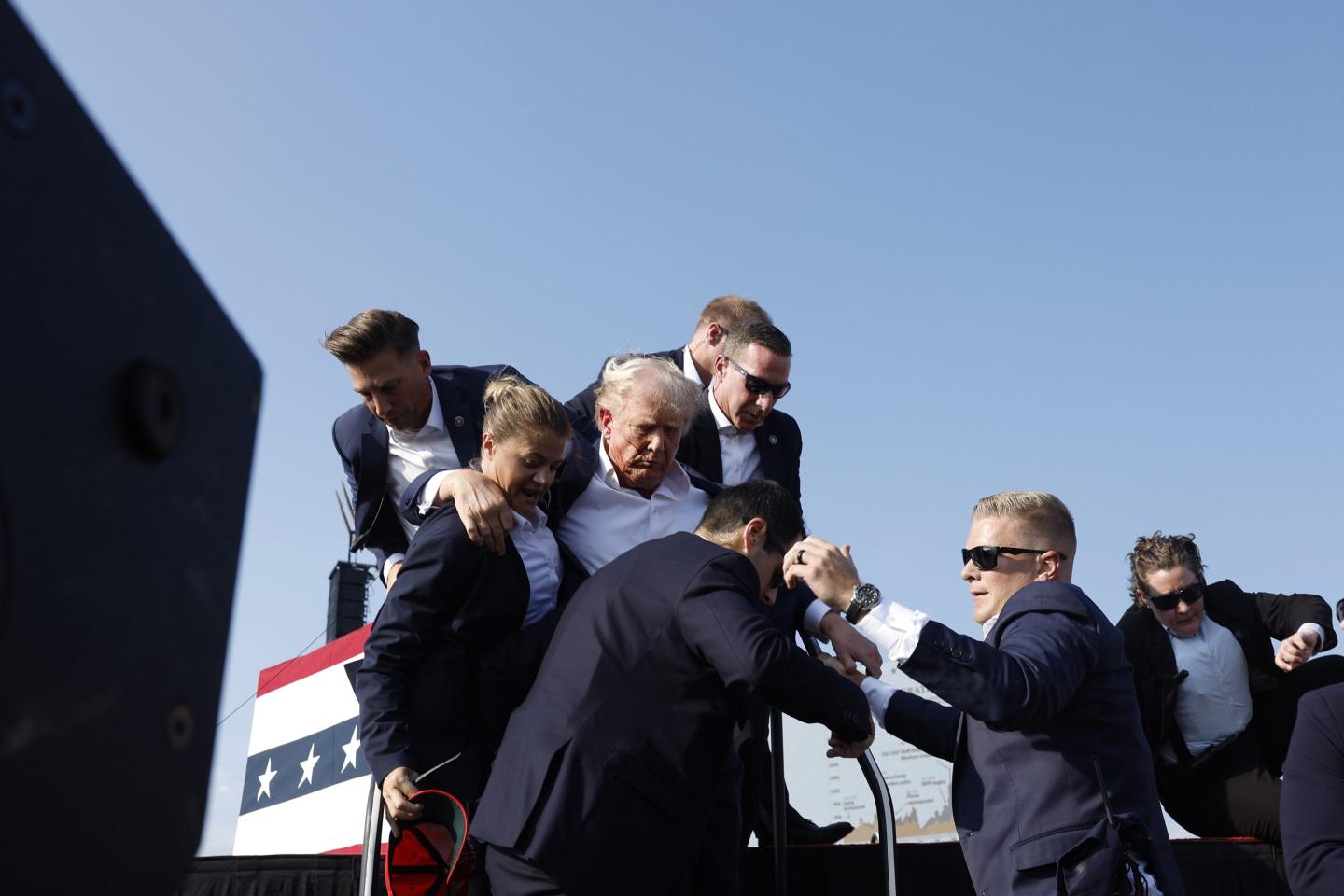 Former President Donald Trump is rushed offstage during a rally on July 13, 2024 in Butler, Pa.