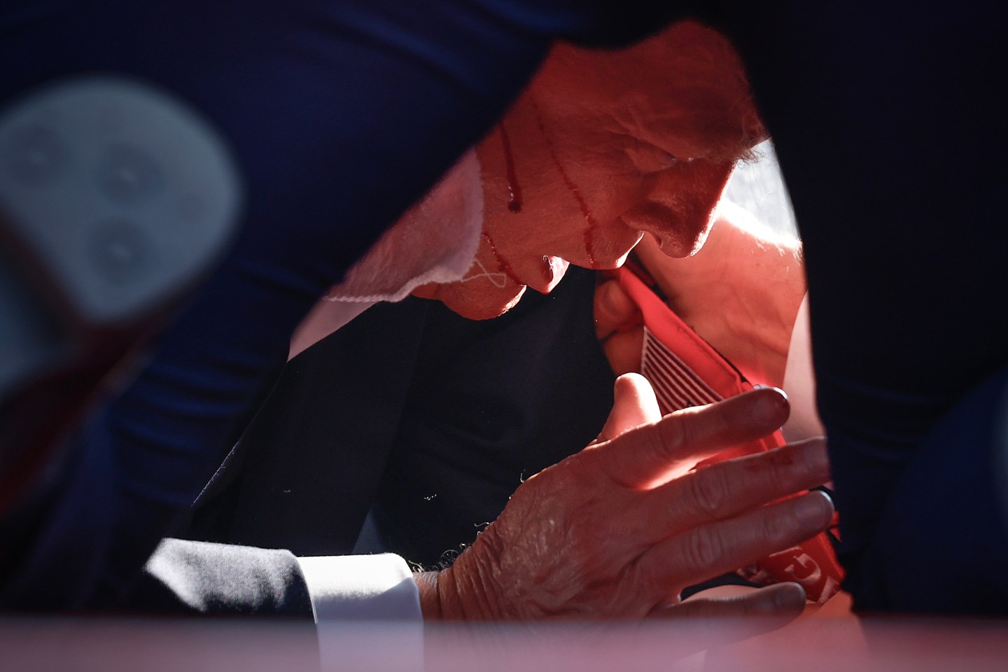 Donald Trump is shown bleeding after a shooting at a rally Saturday in Butler, Pennsylvania.