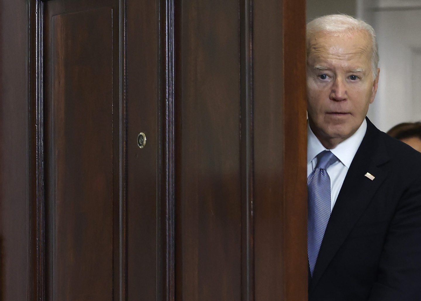 Joe Biden peeks behind door