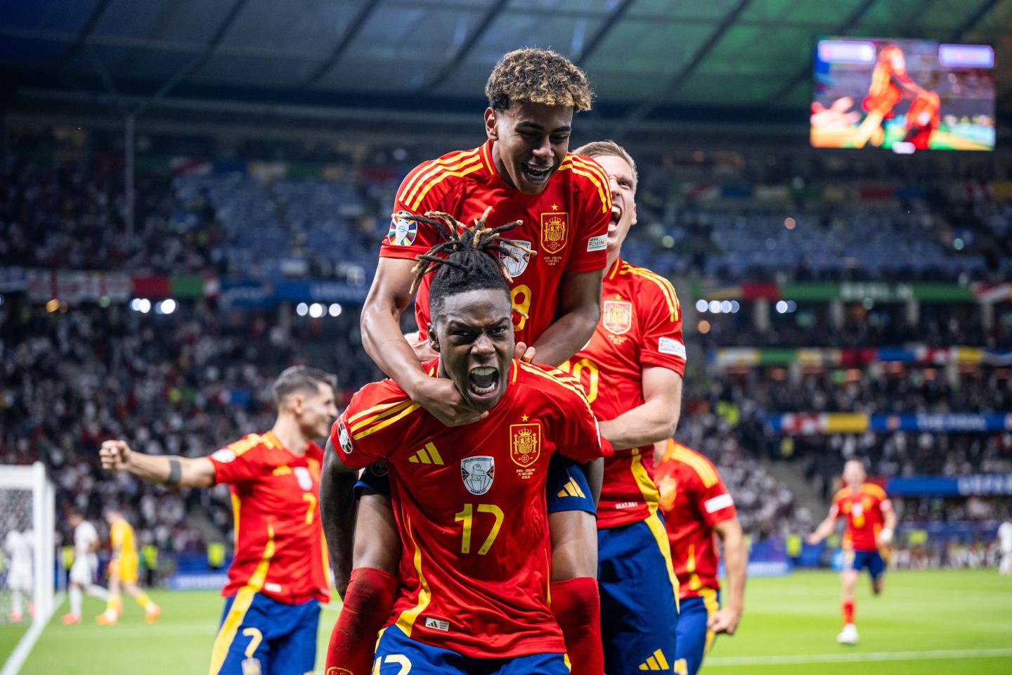 BERLIN, GERMANY - JULY 14: Nico Williams of Spain (17) celebrates after scoring his team's first goal with Lamine Yamal (19) during the UEFA EURO 2024 final match between Spain and England at Olympiastadion on July 14, 2024 in Berlin, Germany. (Photo by Marvin Ibo Guengoer - GES Sportfoto/Getty Images)