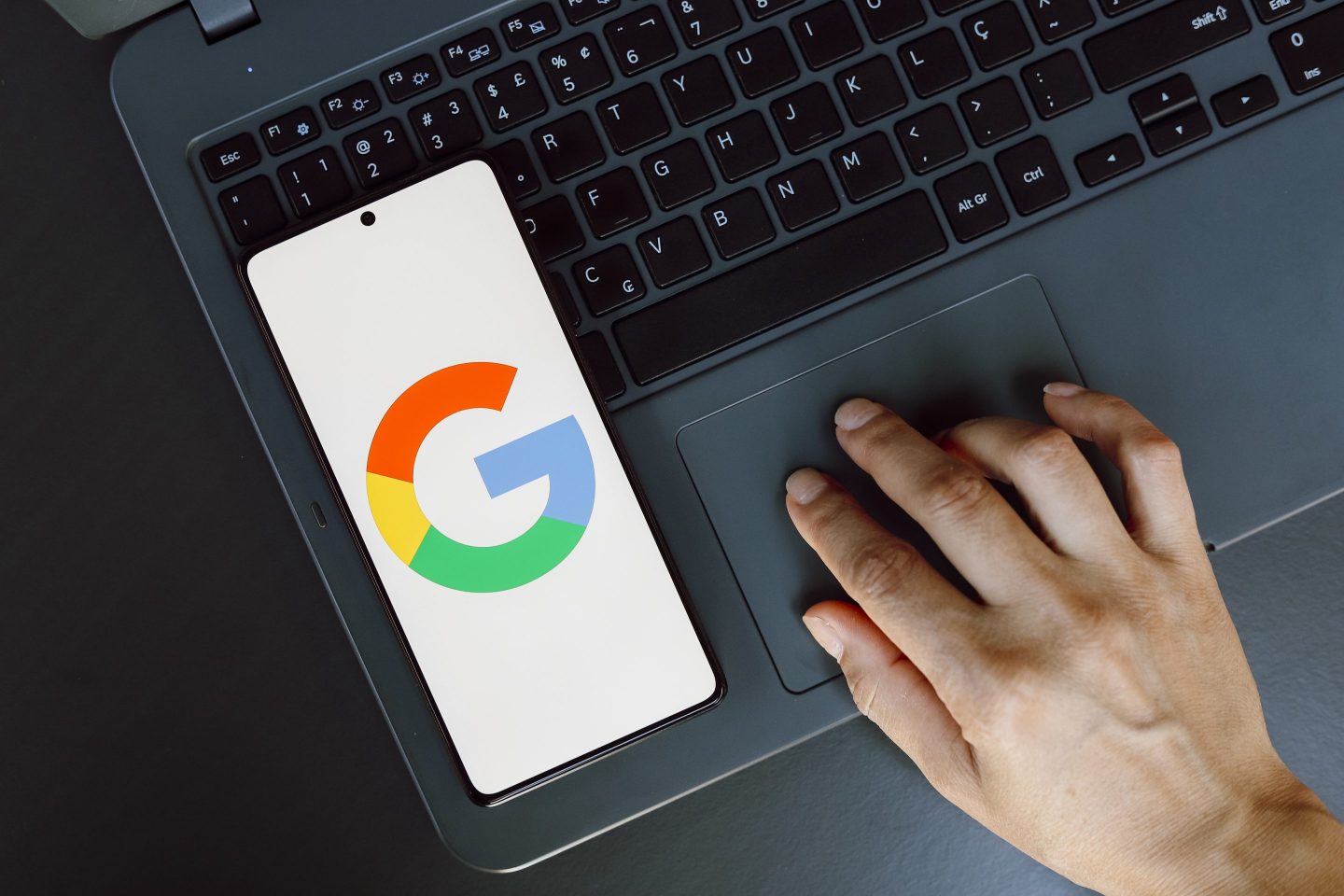 In this photo illustration, the Google logo is displayed on a smartphone screen.