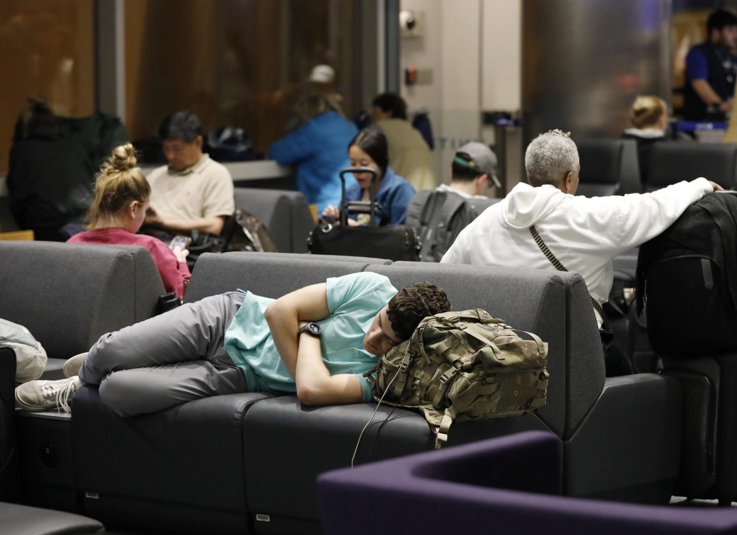 Man lying down in airport