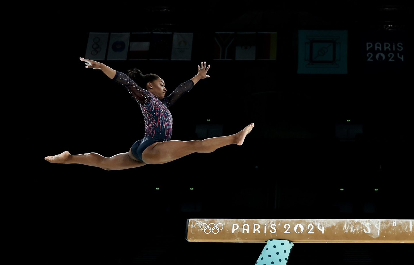 Simone Biles of Team USA practices on the balance beam during a gymnastics training session in the Bercy Arena ahead of the Paris 2024 Olympic Games on Thursday, July 25, 2024, in Paris.