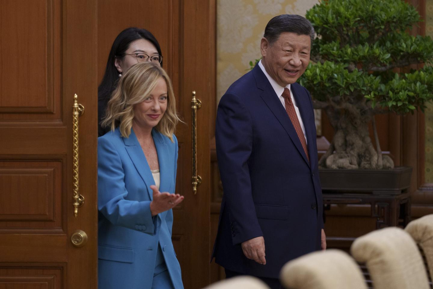 BEIJING, CHINA - JULY 29: Chinese President Xi Jinping, right, arrives with Italian Premier Giorgia Meloni, left, for a meeting at the Diaoyutai State Guesthouse on July 29, 2024 in Beijing, China. (Photo by Vincent Thian - Pool/Getty Images)