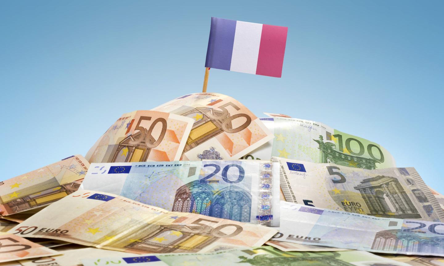 French flag on top of euro notes