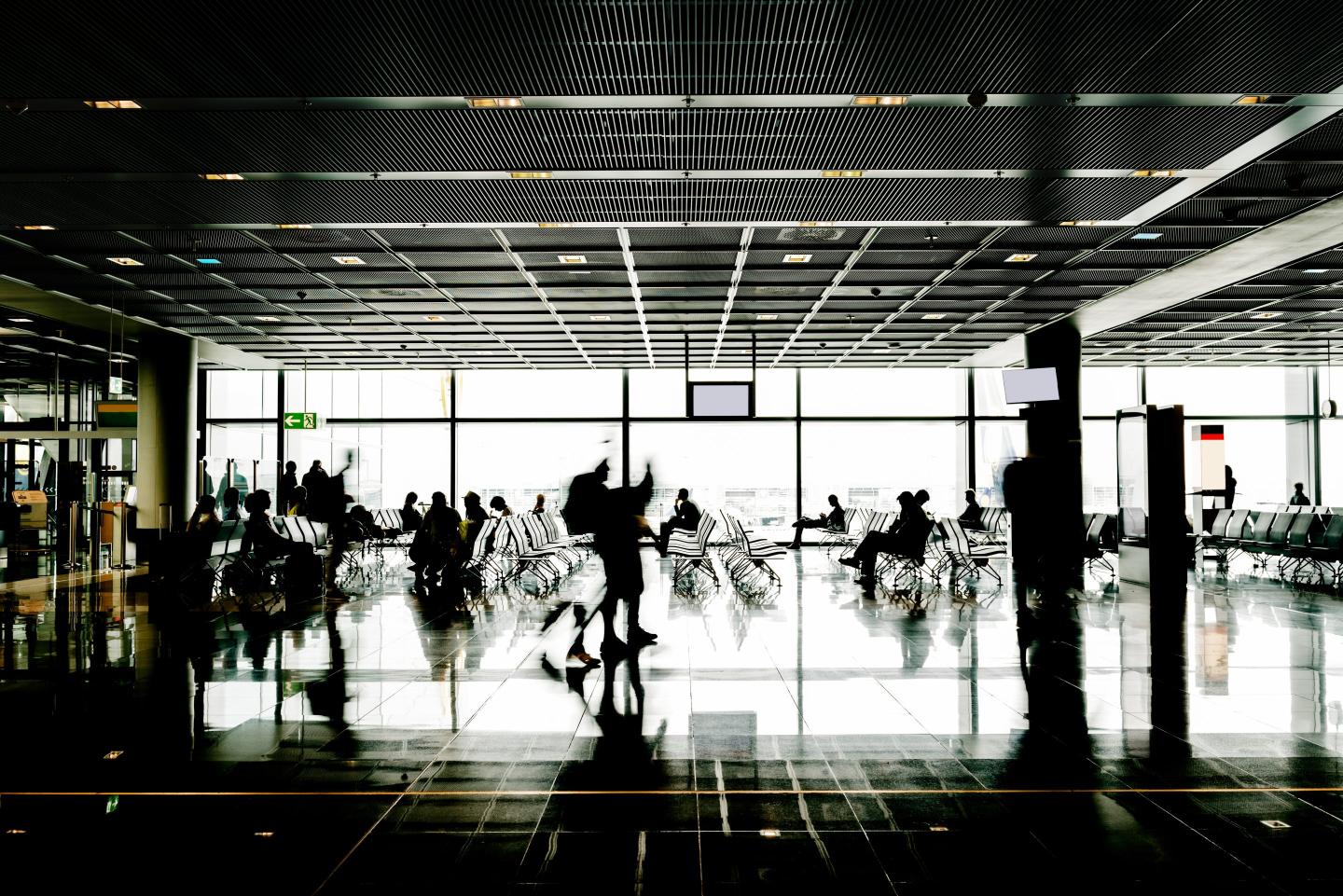 Blurred motion of people waiting at the airport.