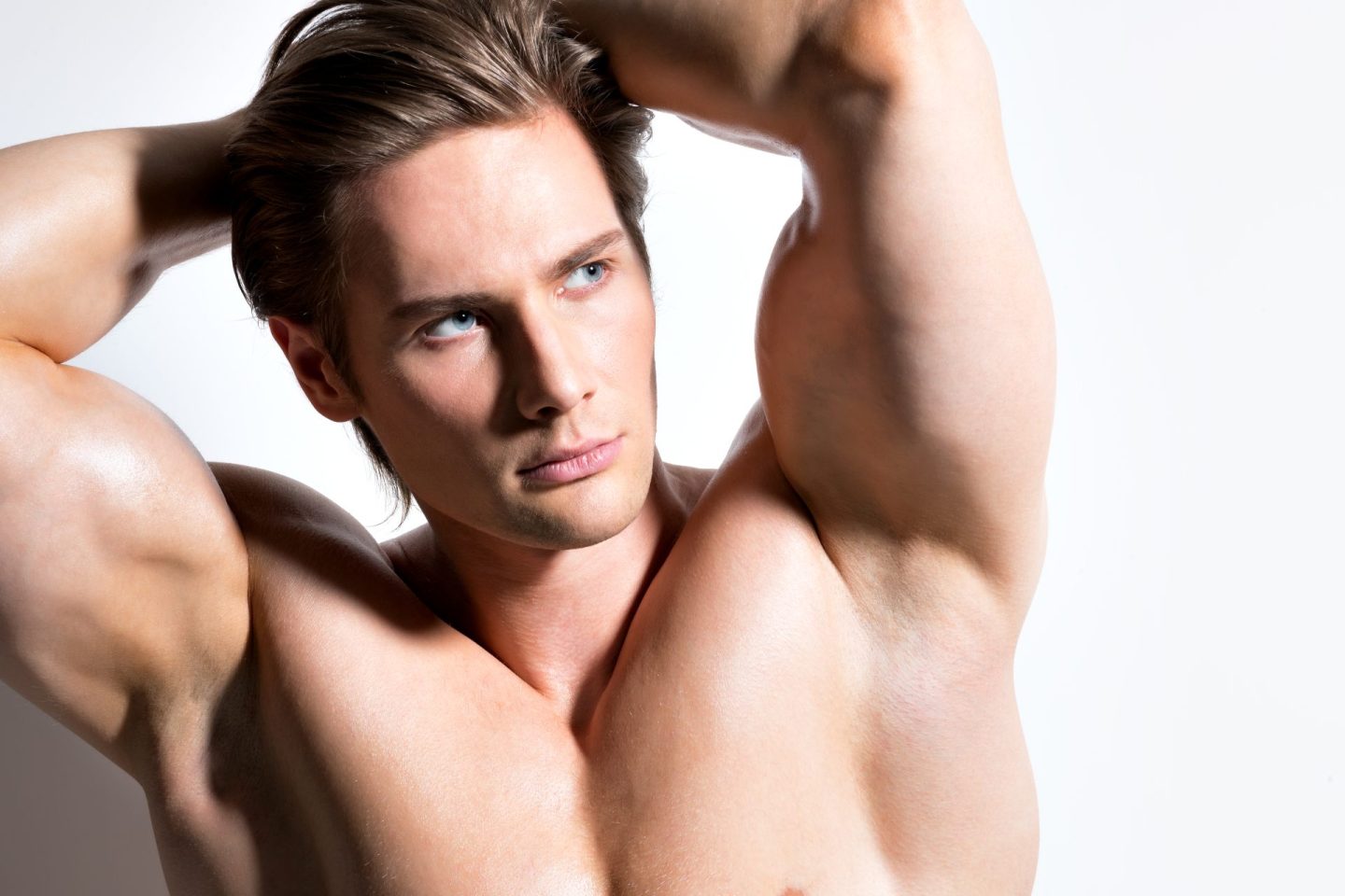 Young man with muscles posing