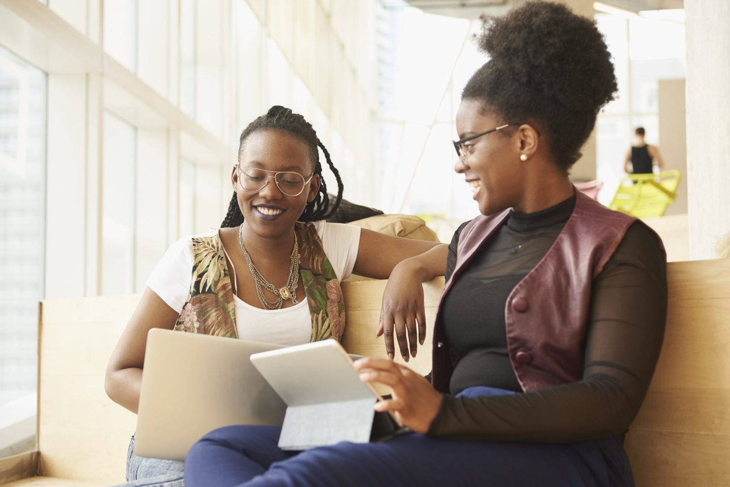 Two women are friends at work.