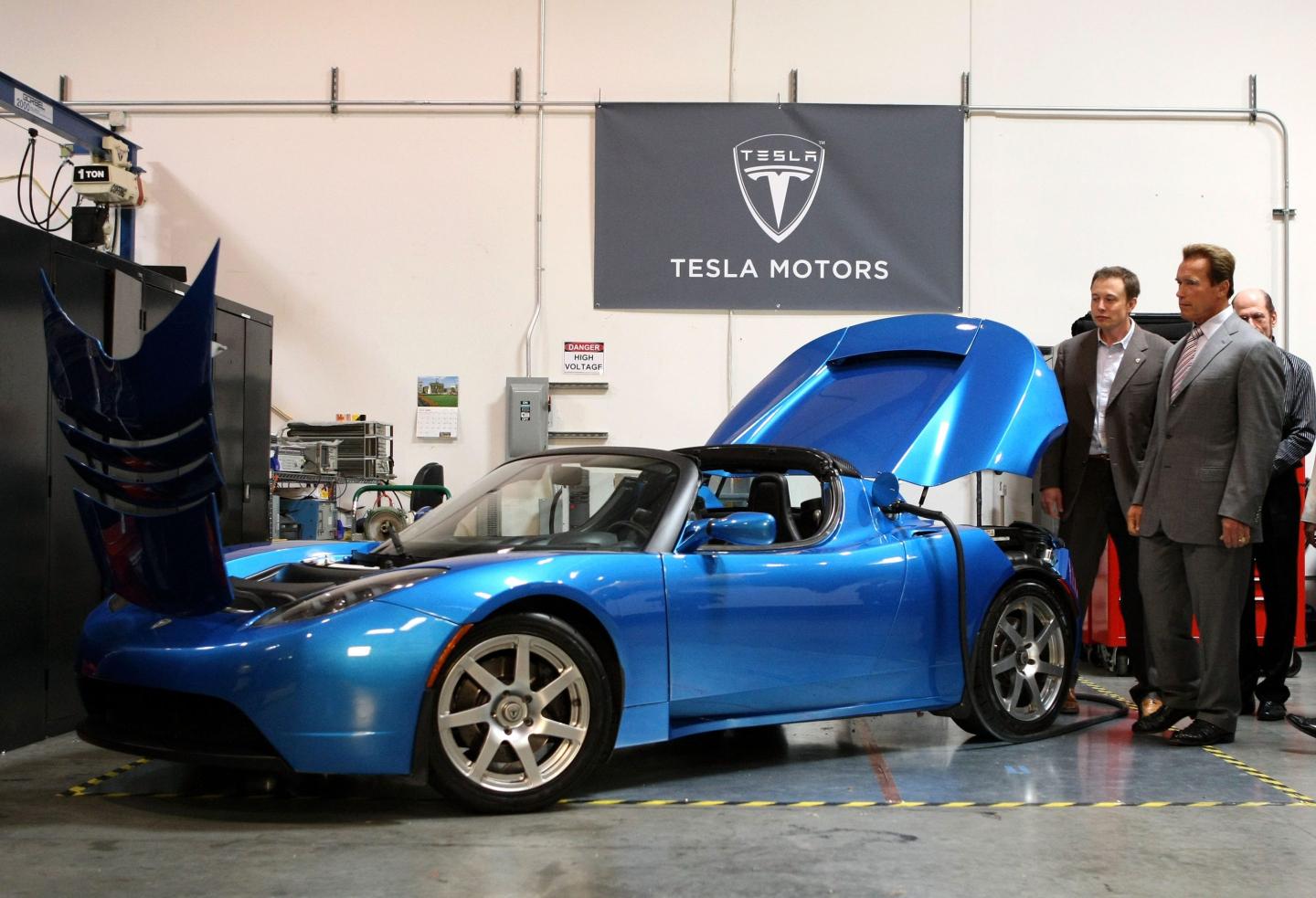 Arnold Schwarzenegger (then California governor) and Elon Musk look at a Tesla Roadster in June 2008 at Tesla Motors in San Carlos, California.