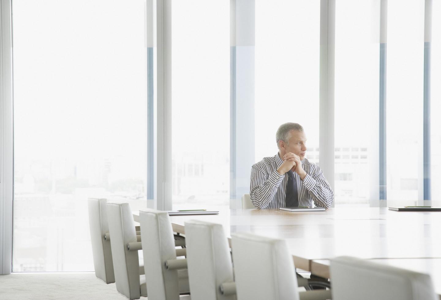 Businessman sitting at conference table