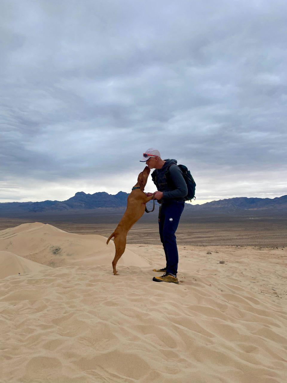 Tim and his dog Minka (a Hungarian Vizsla) at the Kelso Dunes in Mojave National Preserve.