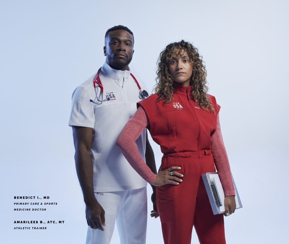 Dr. Benedict I. (left), a primary care and sports medicine physician, and Amarilees B., an athletic trainer, wear Team USA Medical Team gear designed by Figs. More than 250 health care professionals will wear the uniforms at the 2024 Summer Olympics and Paralympics in Paris.