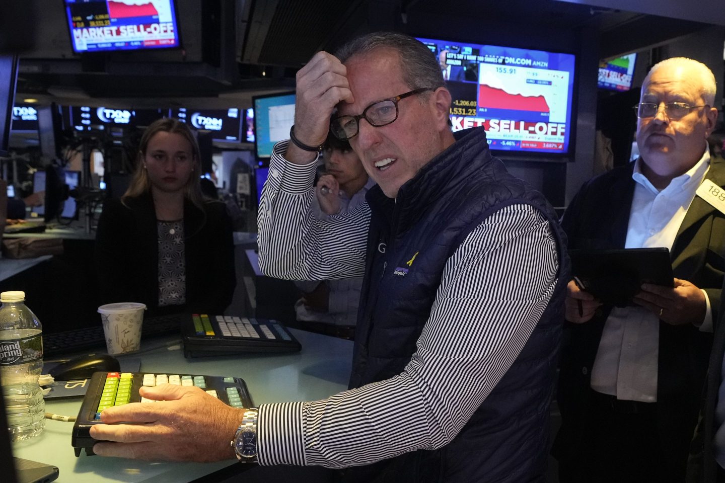 stock traders look at screens