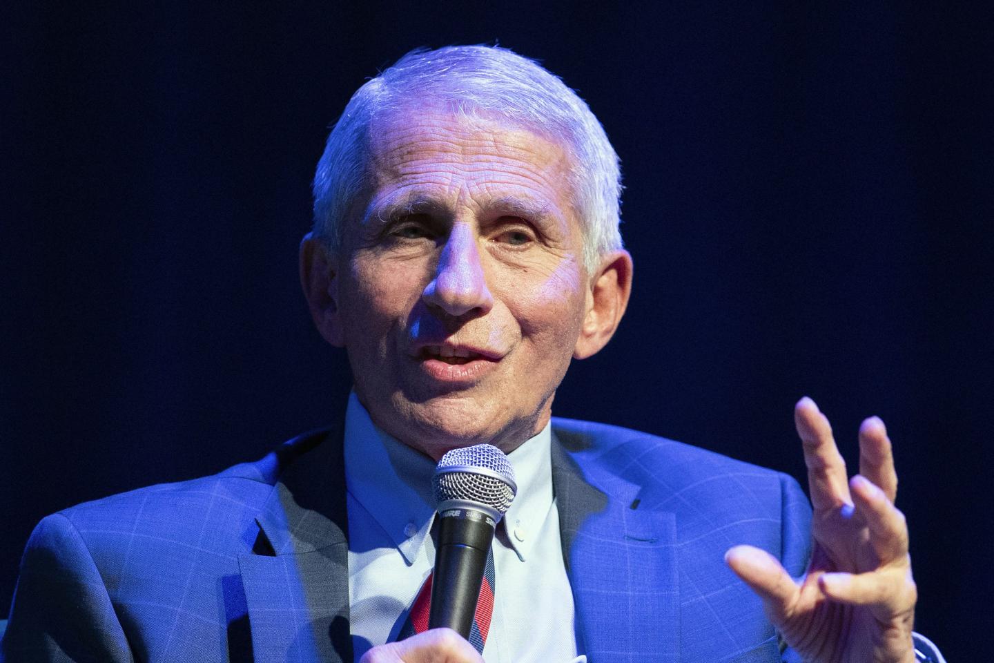 Anthony Fauci speaks with microphone