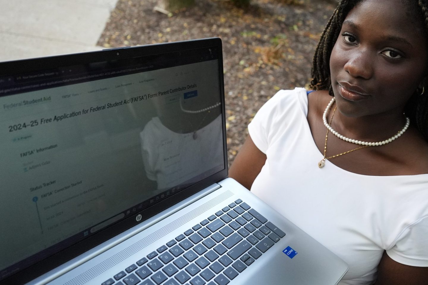 Adjovi Golo holds a laptop at DePaul University in Chicago.