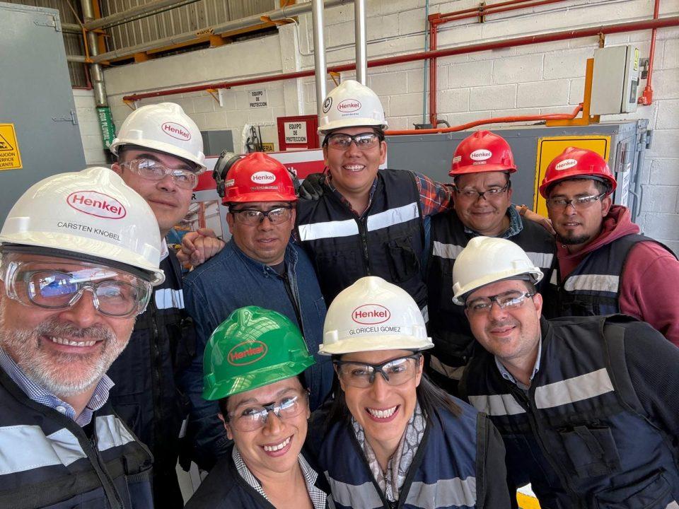 Henkel's CEO on ground, with colleagues.