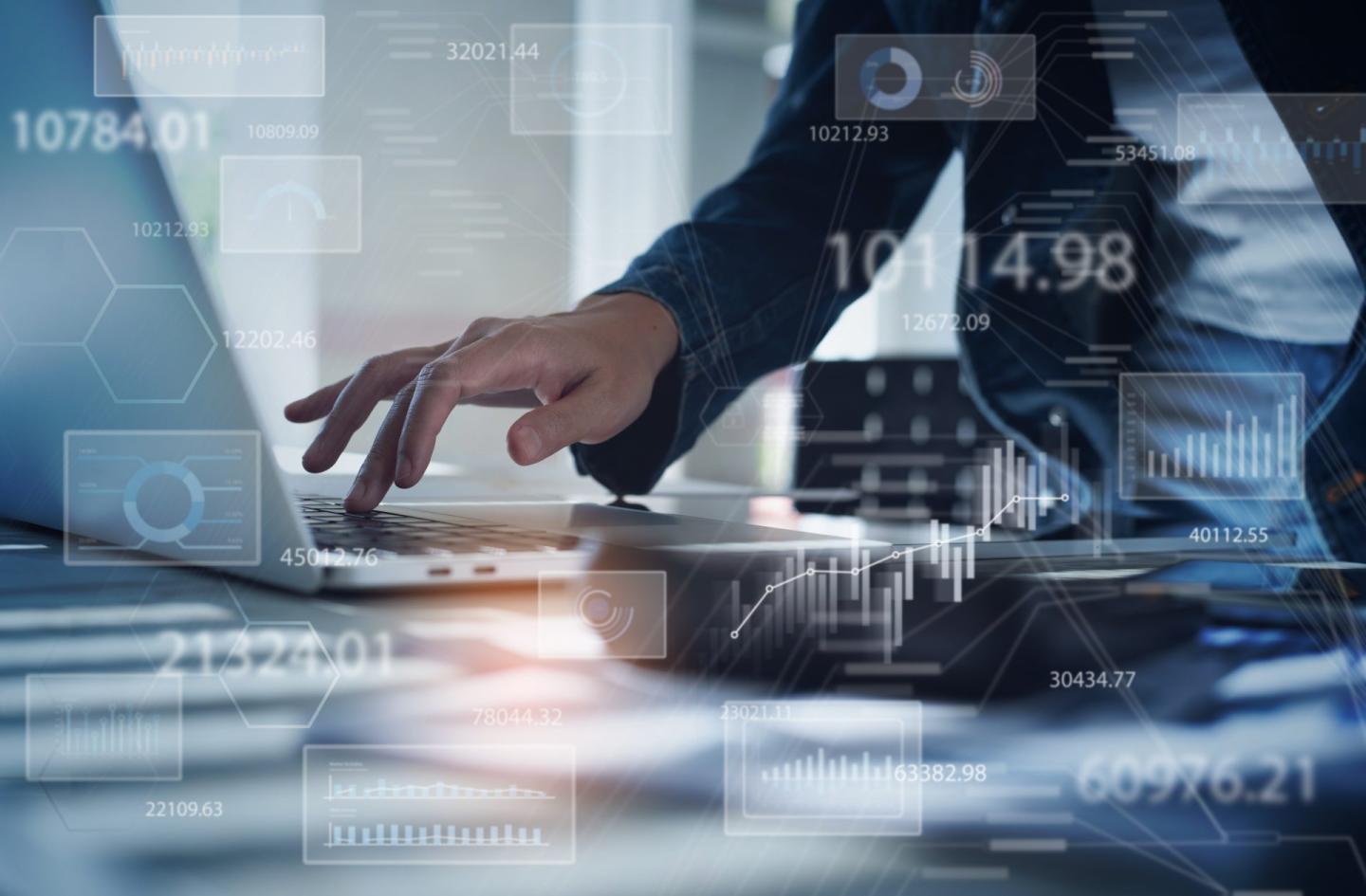 Businesswoman working on laptop computer analyzing sales data and economic growth graph chart. Business strategy, digital market report analysis, data scientist