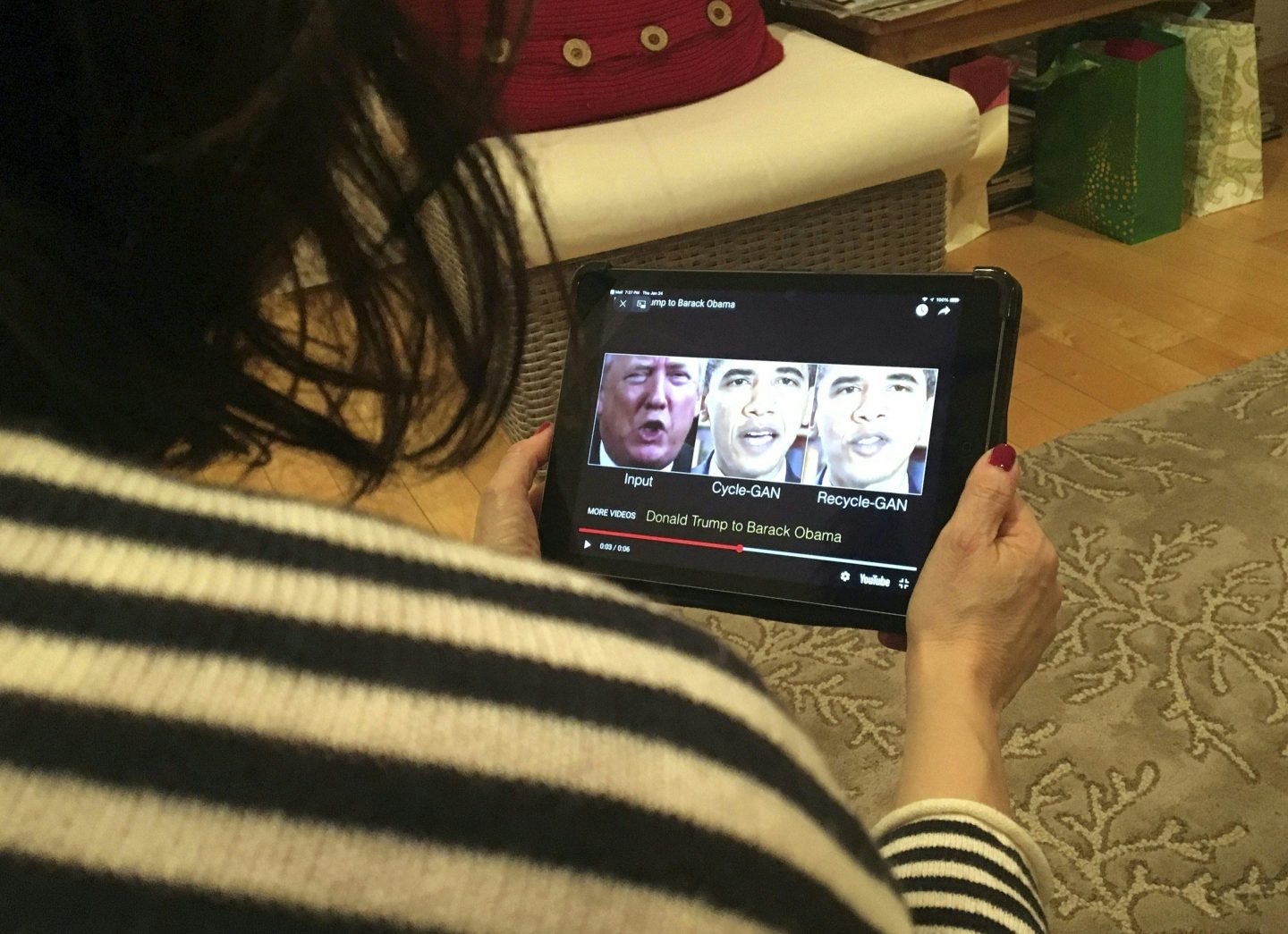 A woman in Washington, DC, views a manipulated video on January 24, 2019, that changes what is said by President Donald Trump and former president Barack Obama, illustrating how deepfake technology can deceive viewers.
