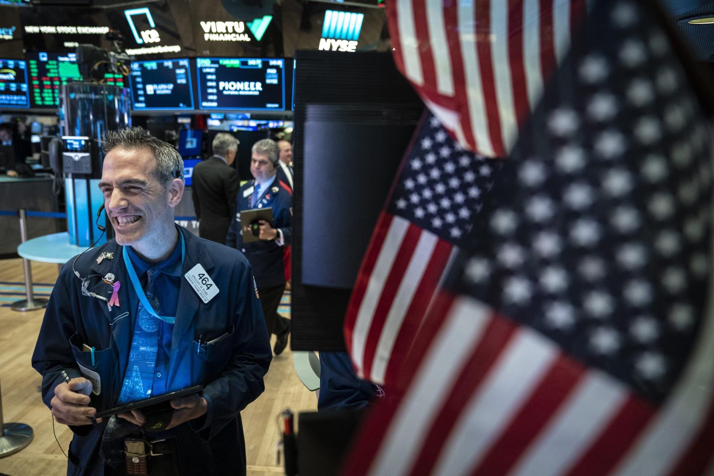 Wall Street trader smiling