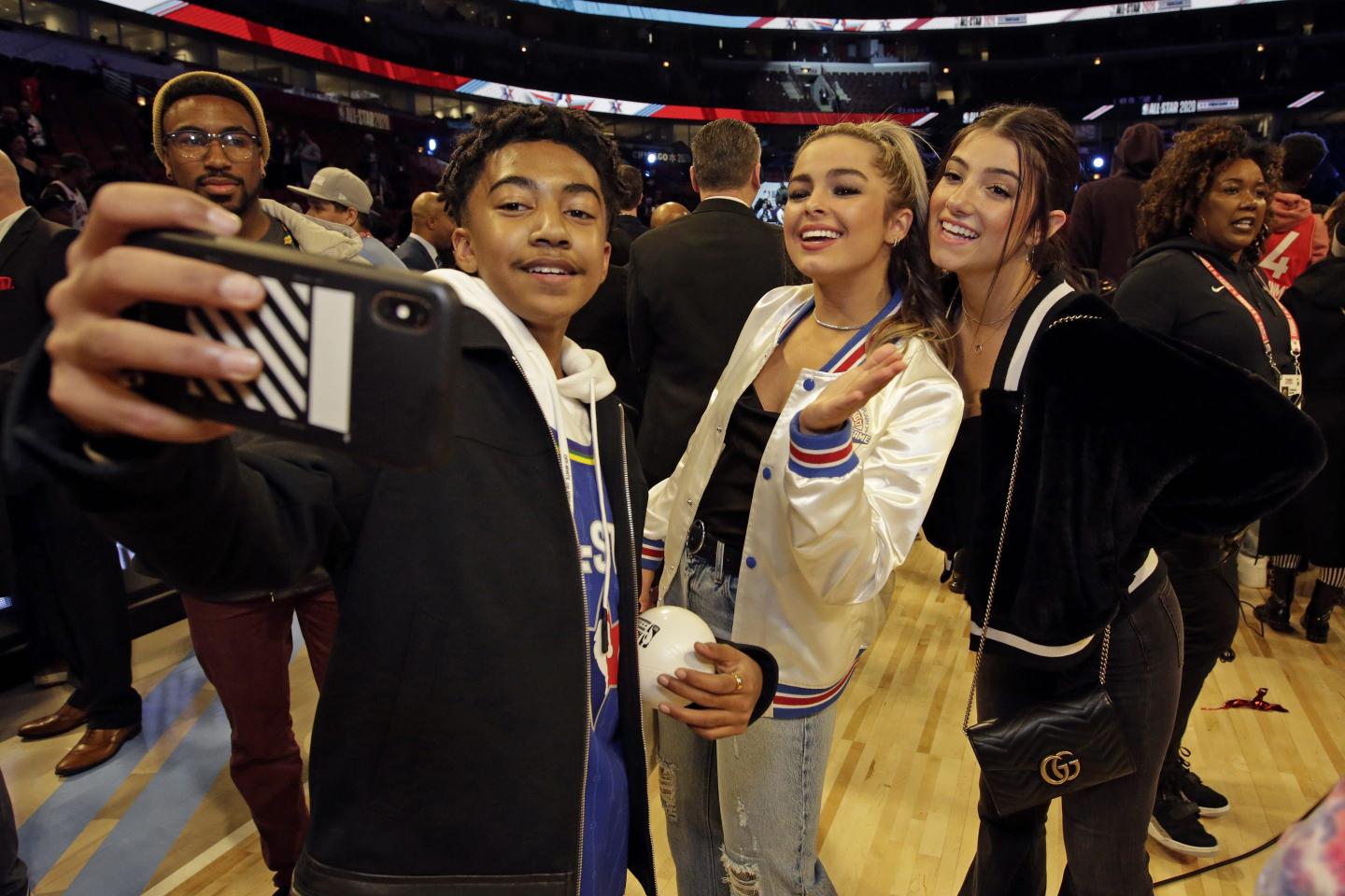 CHICAGO, IL - FEBRUARY 16: Actor Miles Brown takes a selfie with Tik Tok Stars Addison Rae Easterling and Charli D'Amelio during the 69th NBA All-Star Game as part of 2020 NBA All-Star Weekend on February 16, 2020 at United Center in Chicago, Illinois. NOTE TO USER: User expressly acknowledges and agrees that, by downloading and/or using this Photograph, user is consenting to the terms and conditions of the Getty Images License Agreement. Mandatory Copyright Notice: Copyright 2020 NBAE (Photo by Kena Krutsinger/NBAE via Getty Images)