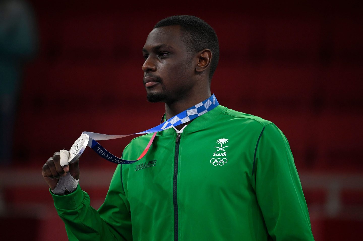 Saudi Arabia's Tareg Hamedi poses with his silver medal in the men's kumite +75kg in the karate competition at a ceremony during the Tokyo 2020 Olympic Games at the Nippon Budokan in Tokyo on August 7, 2021. (Photo by Alexander NEMENOV / AFP) (Photo by ALEXANDER NEMENOV/AFP via Getty Images)