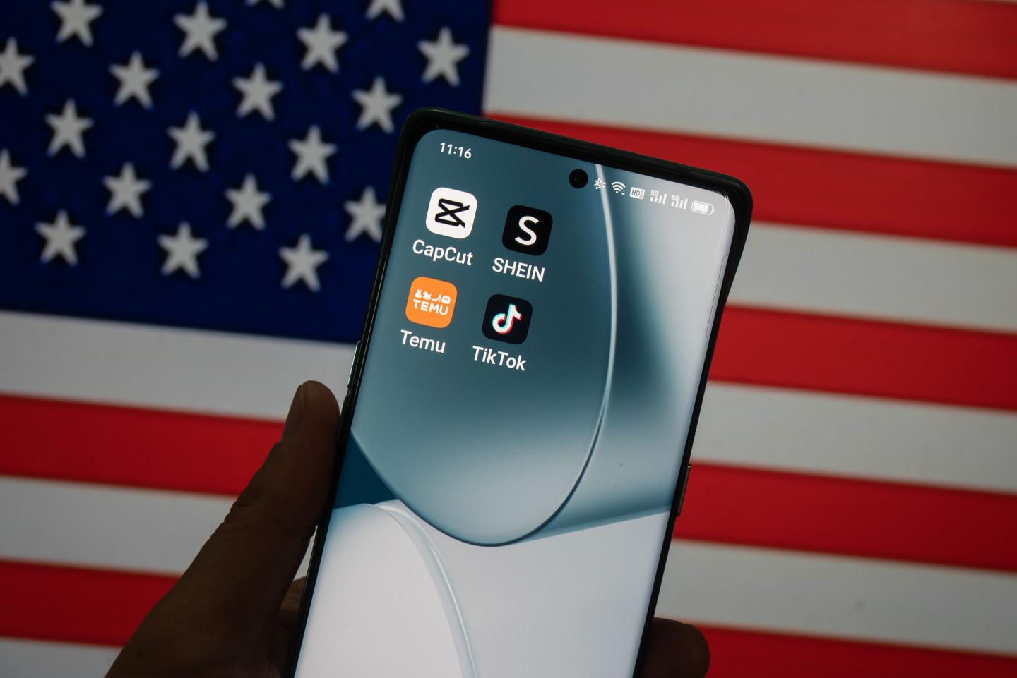 photograph of an iPhone displaying various apps