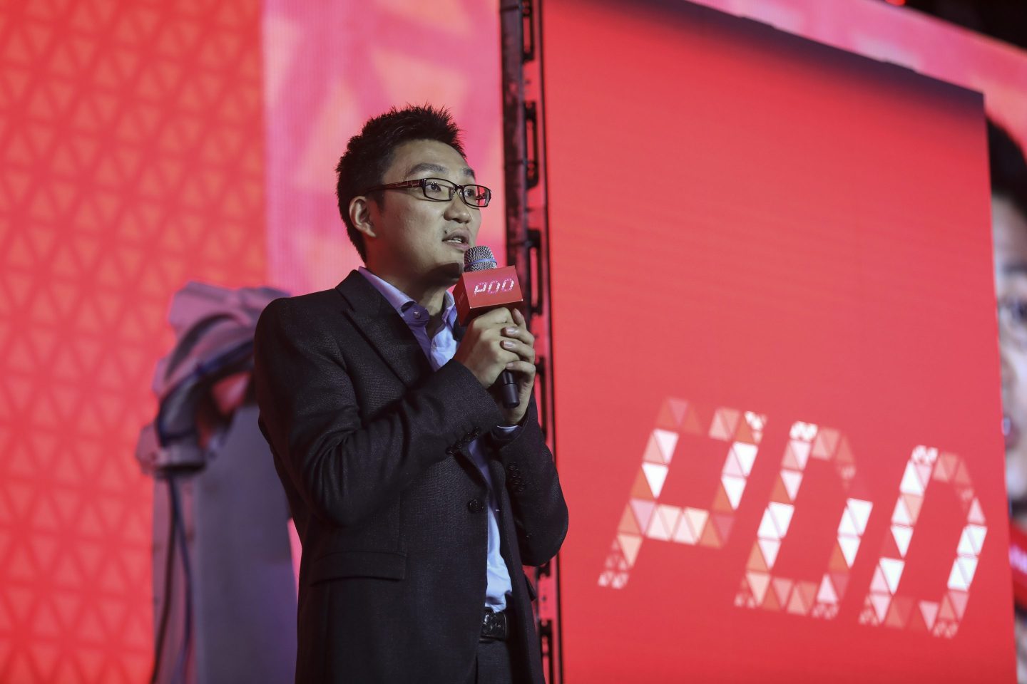 Colin Huang during Pinduoduo's listing ceremony at Shanghai Tower in 2018.