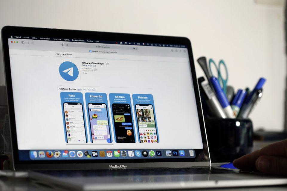 a laptop screen with telegram app on it
