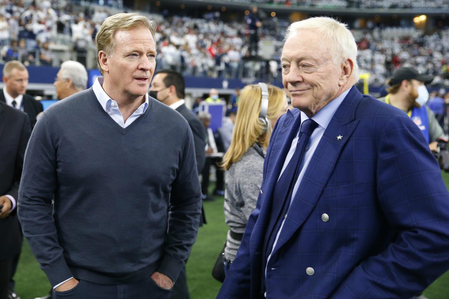 NFL Commissioner Roger Goodell (L) and Dallas Cowboys owner Jerry Jones talk before the 2022 NFC Wild Card Playoff game against the San Francisco 49ers.
