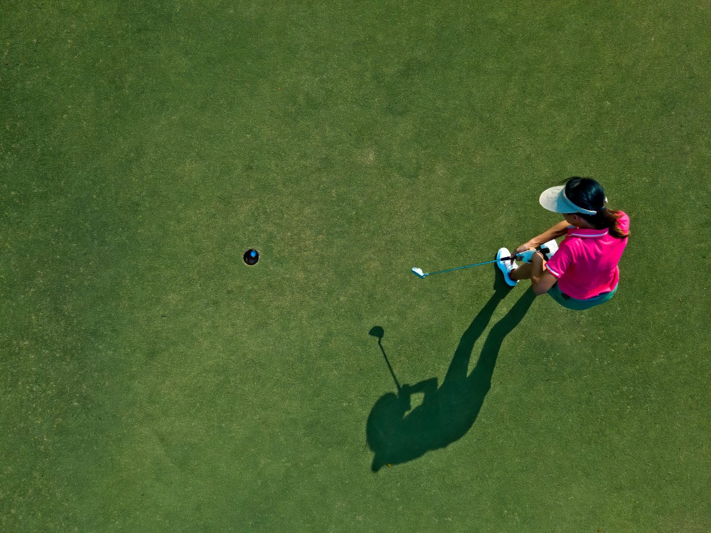 Overhead shot of a woman golfing