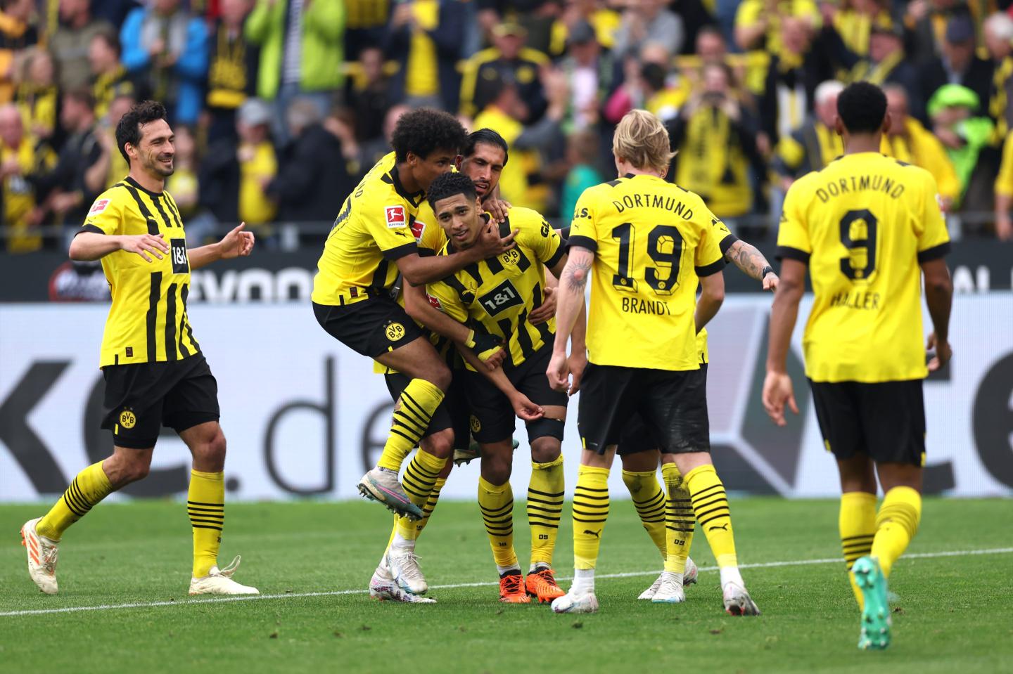DORTMUND, GERMANY - MAY 07: Jude Bellingham (C) of Borussia Dortmund celebrates with Karim Adeyemi (2L), Emre Can and teammates after scoring the team's fourth goal during the Bundesliga match between Borussia Dortmund and VfL Wolfsburg at Signal Iduna Park on May 07, 2023 in Dortmund, Germany. (Photo by Lars Baron/Getty Images)