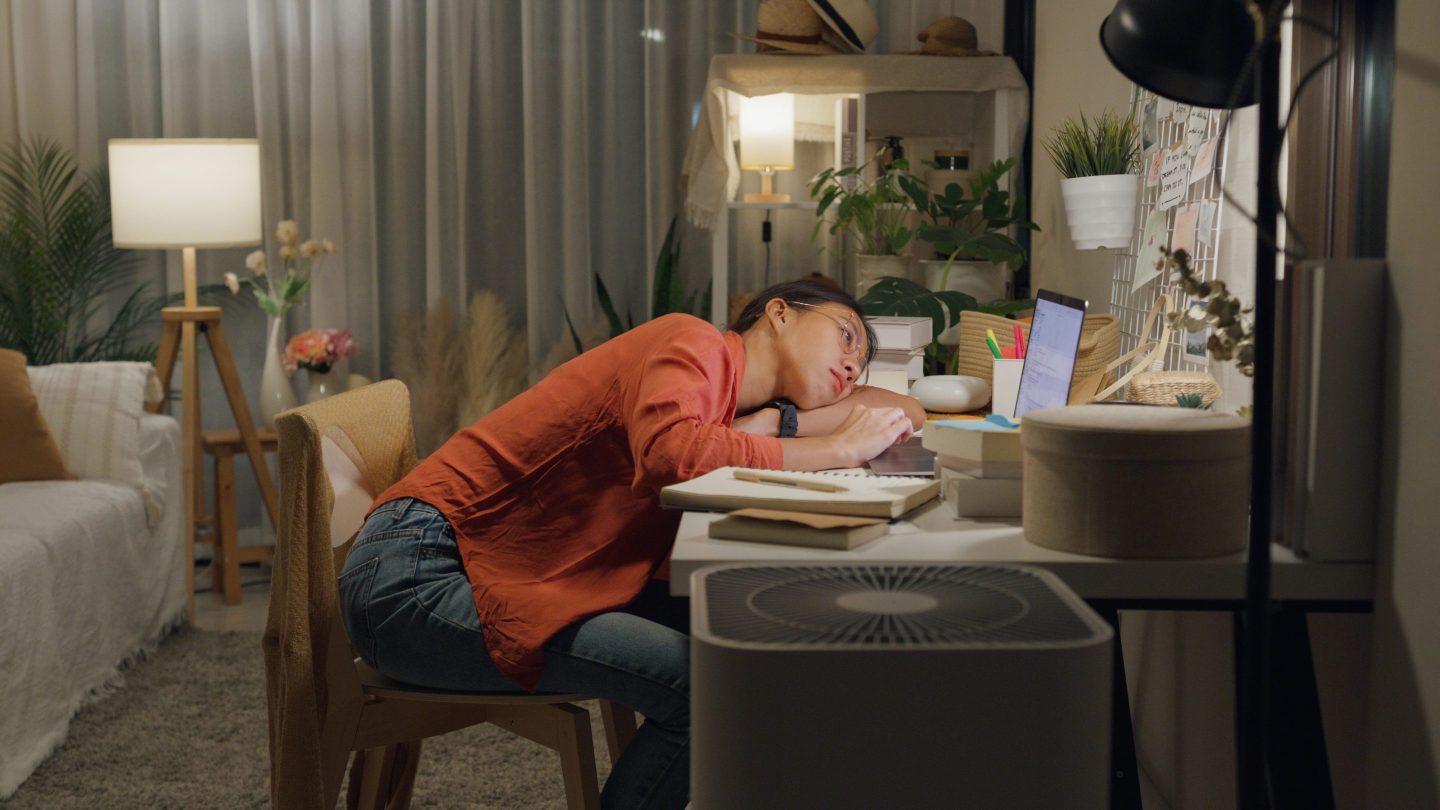 Women is stressed looking for job on laptop