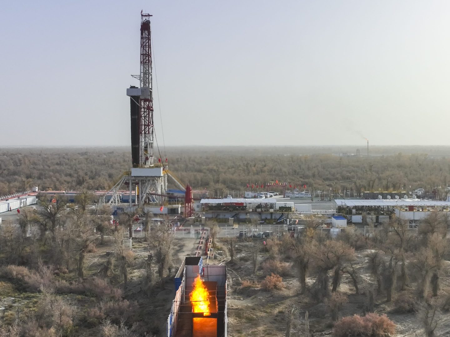 Flames burn off at the Yuejin 3-3 well operated by China Petrochemical Corporation (Sinopec Group) in the Tarim Basin on November 14, 2023 in Aksu Prefecture, Xinjiang Uygur Autonomous Region of China.