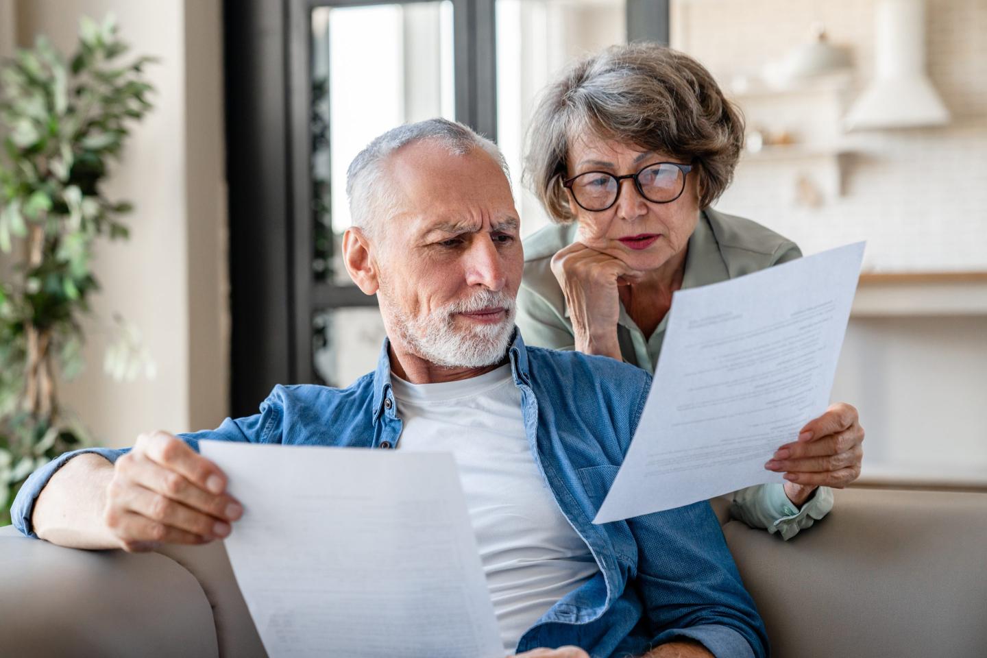 Senior grandparents reading documents