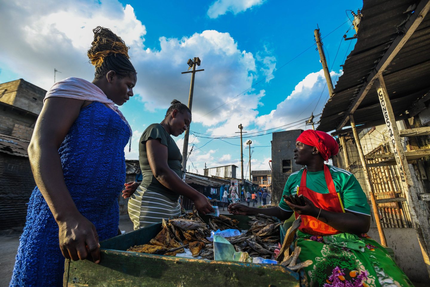 Investing in women and their businesses in Africa provides a widespread boost to families, communities, and the economy. Above, peddlers selling local delicacies in Nairobi, Kenya.
