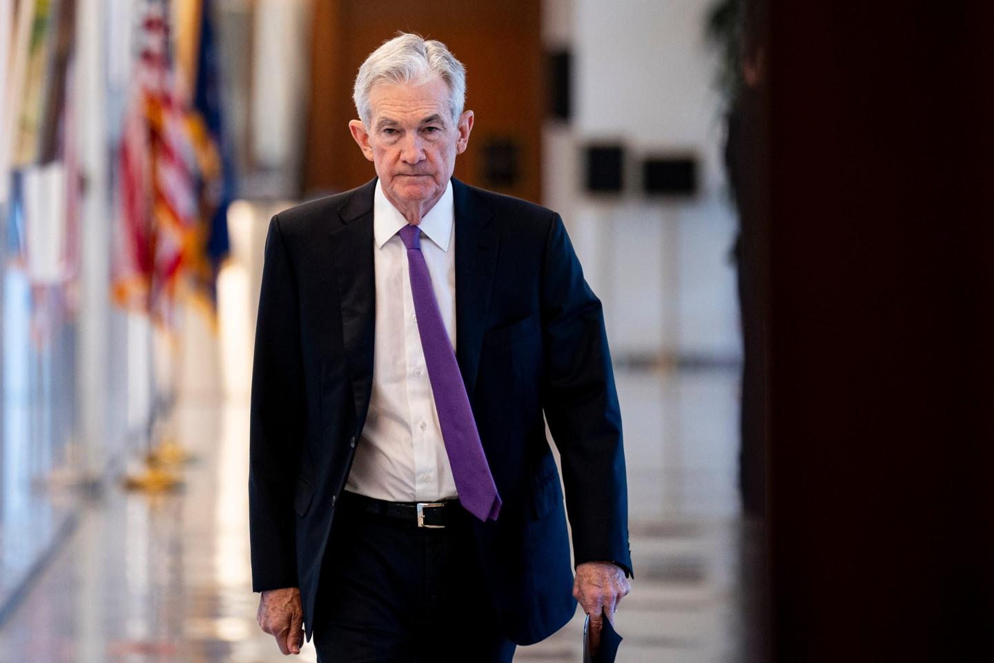 Jerome Powell walks down hallway