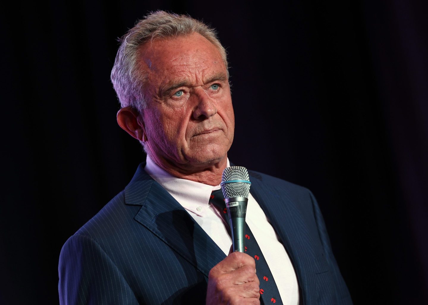 Robert F. Kennedy Jr. holds microphone