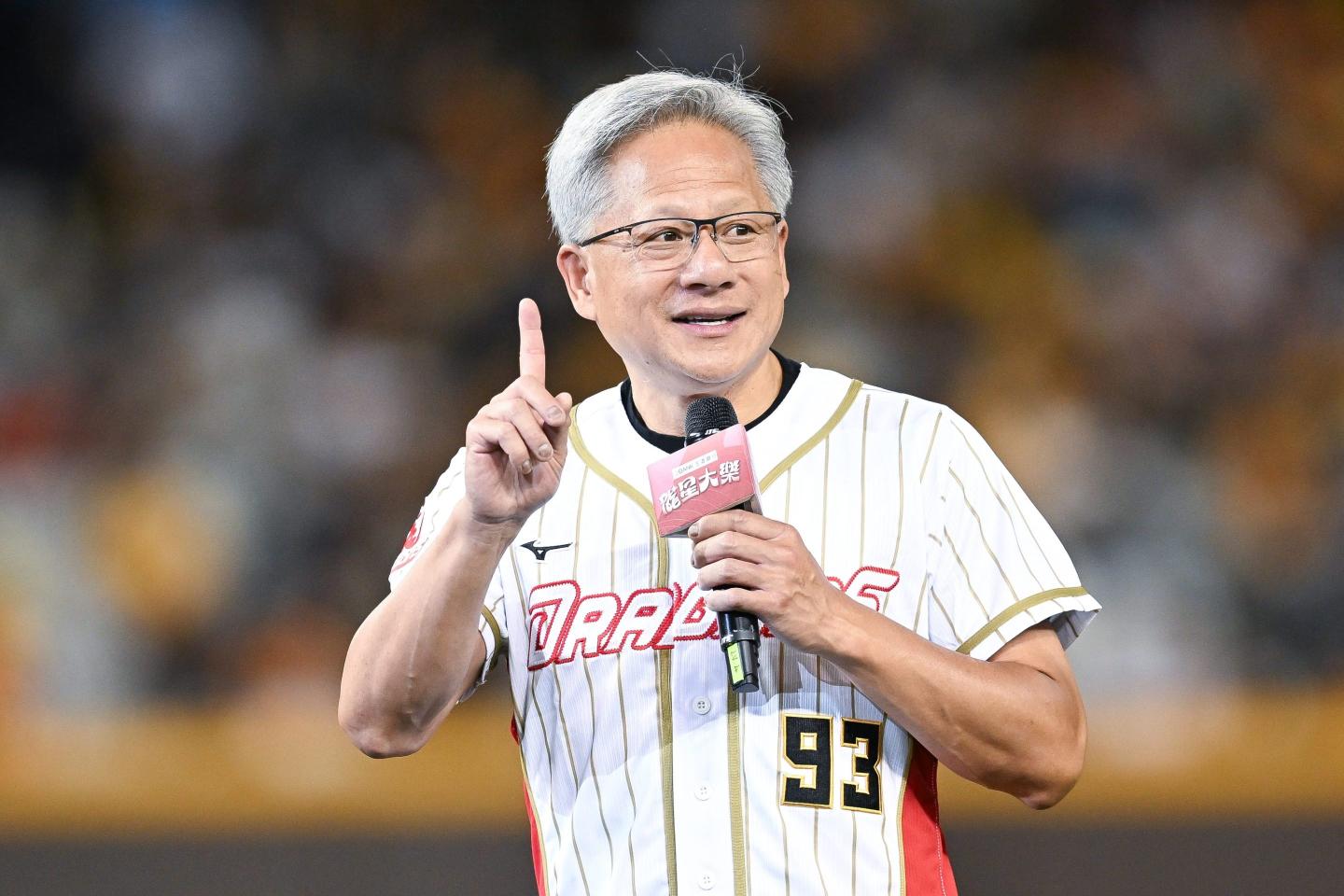 NVIDIA CEO Jensen Huang talks prior to the CPBL game between CTBC Brothers and Wei Chuan Dragons at at Taipei Dome on June 01, 2024 in Taipei, Taiwan.