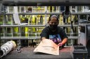 A worker prepares packages at an Amazon fulfillment center on Prime Day.