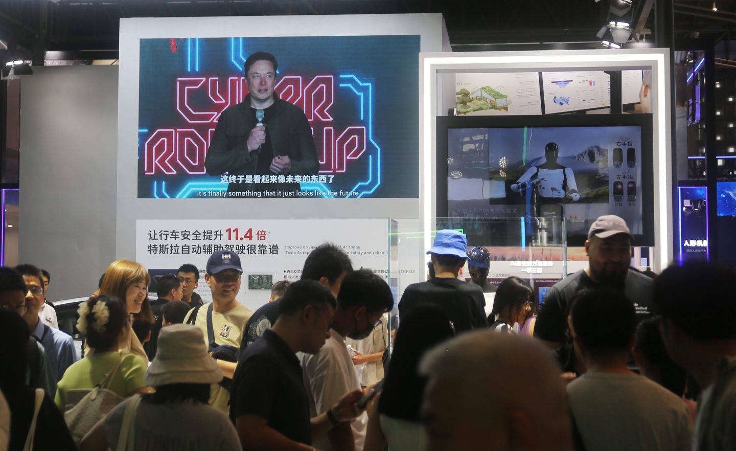 Visitors view Tesla's humanoid robot Optimus Prime II in Shanghai on July 7.