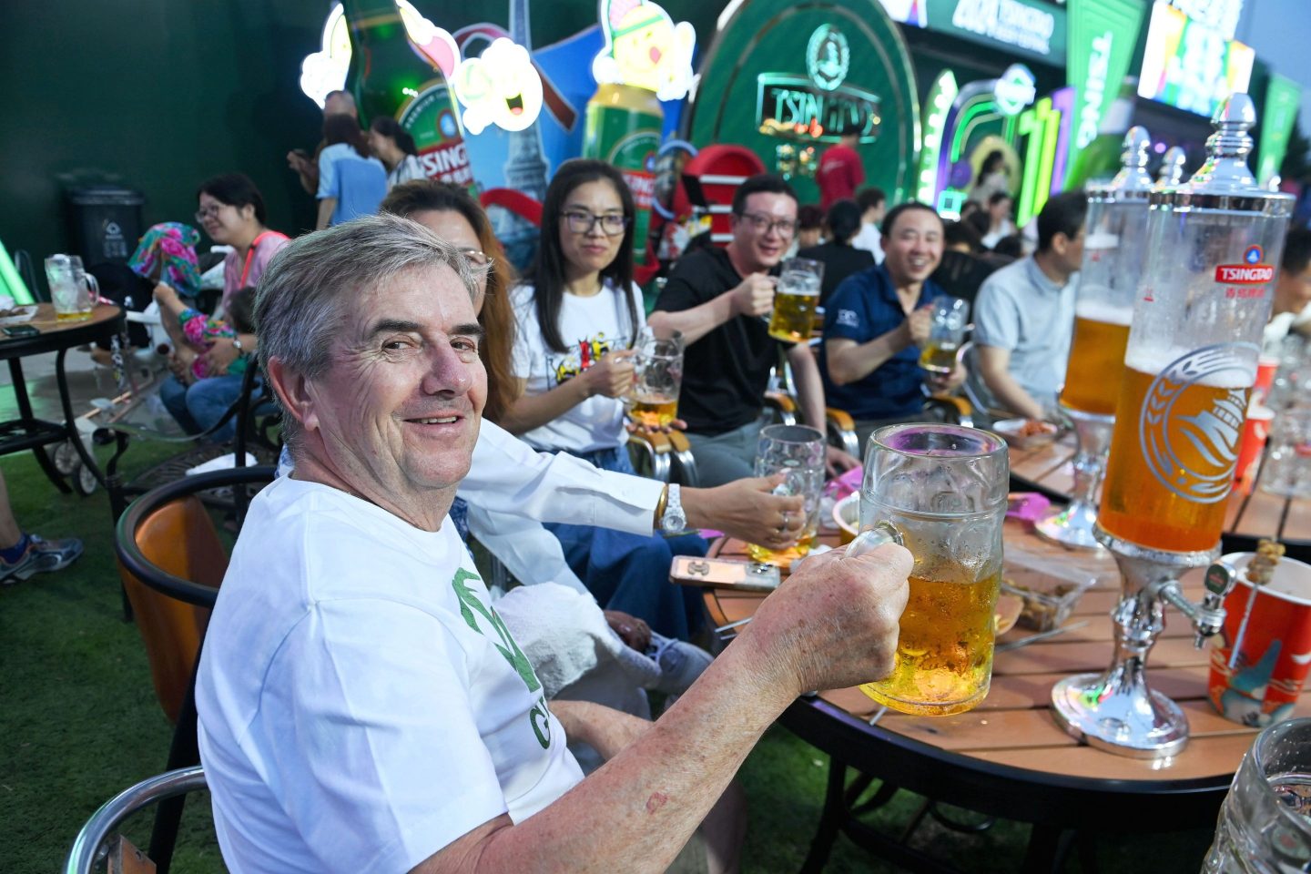 Tourists drinking at Golden Beach Beer City, in Qingdao, China, July 24, 2024.