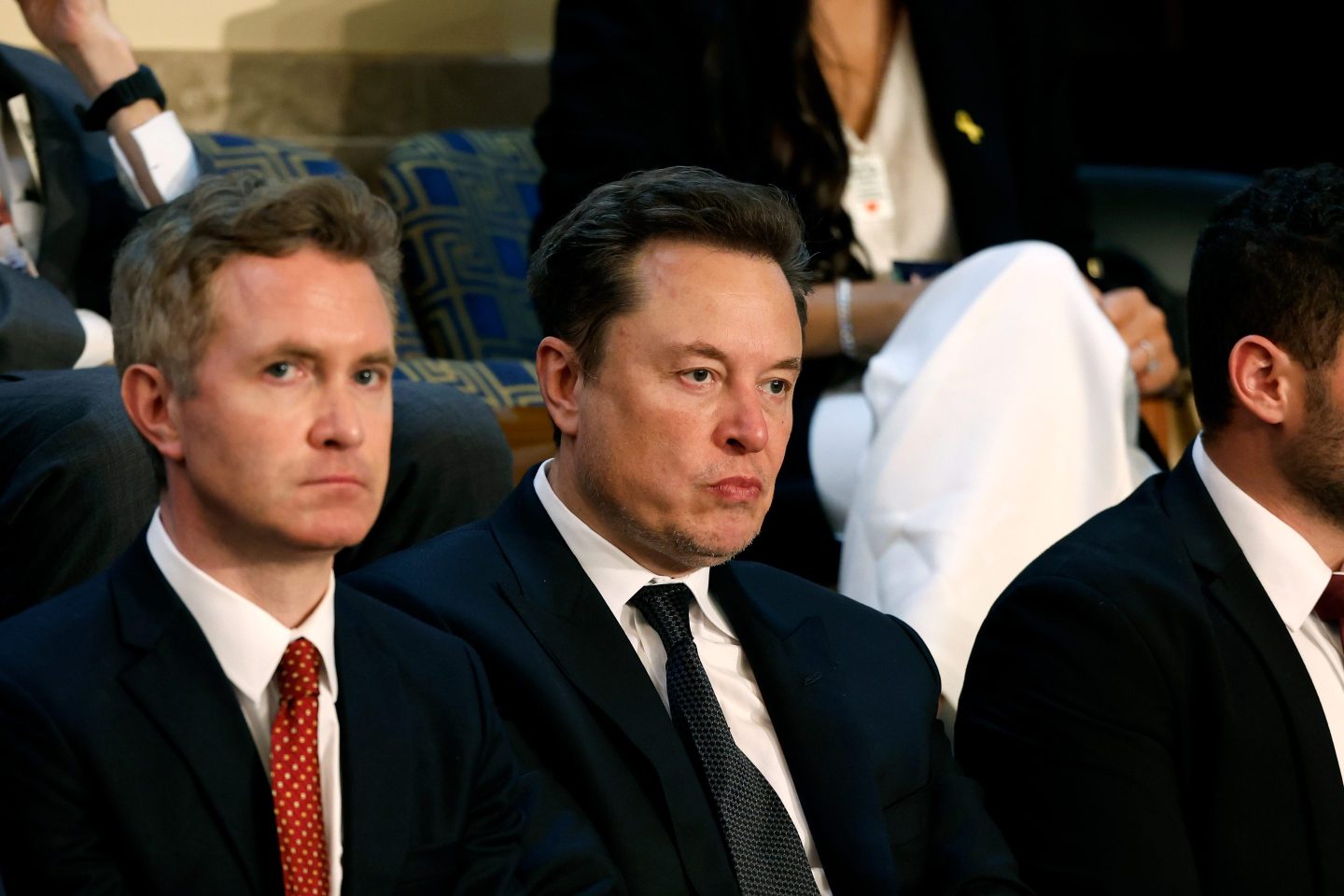 WASHINGTON, DC - JULY 24: Tesla CEO Elon Musk (C) listens as Israeli Prime Minister Benjamin Netanyahu addresses a joint meeting of Congress in the chamber of the House of Representatives at the U.S. Capitol on July 24, 2024 in Washington, DC. Netanyahu’s visit occurs as the Israel-Hamas war reaches nearly ten months. A handful of Senate and House Democrats boycotted the remarks over Israel’s treatment of Palestine. (Photo by Anna Moneymaker/Getty Images)
