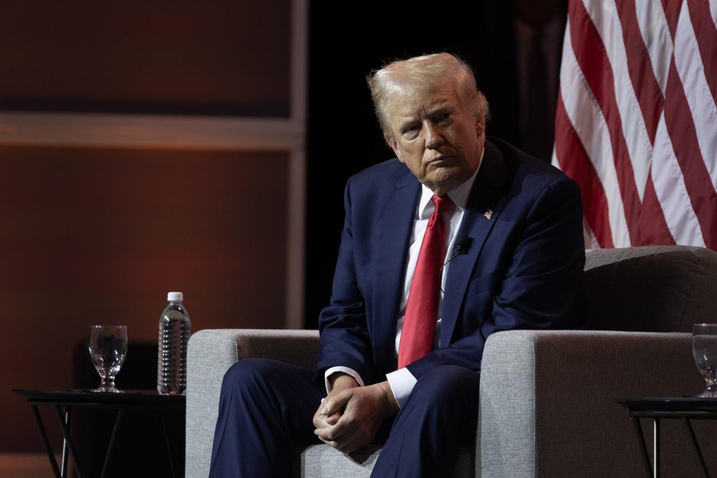 Trump sitting in chair