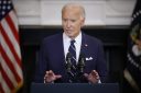 Joe Biden stands at podium