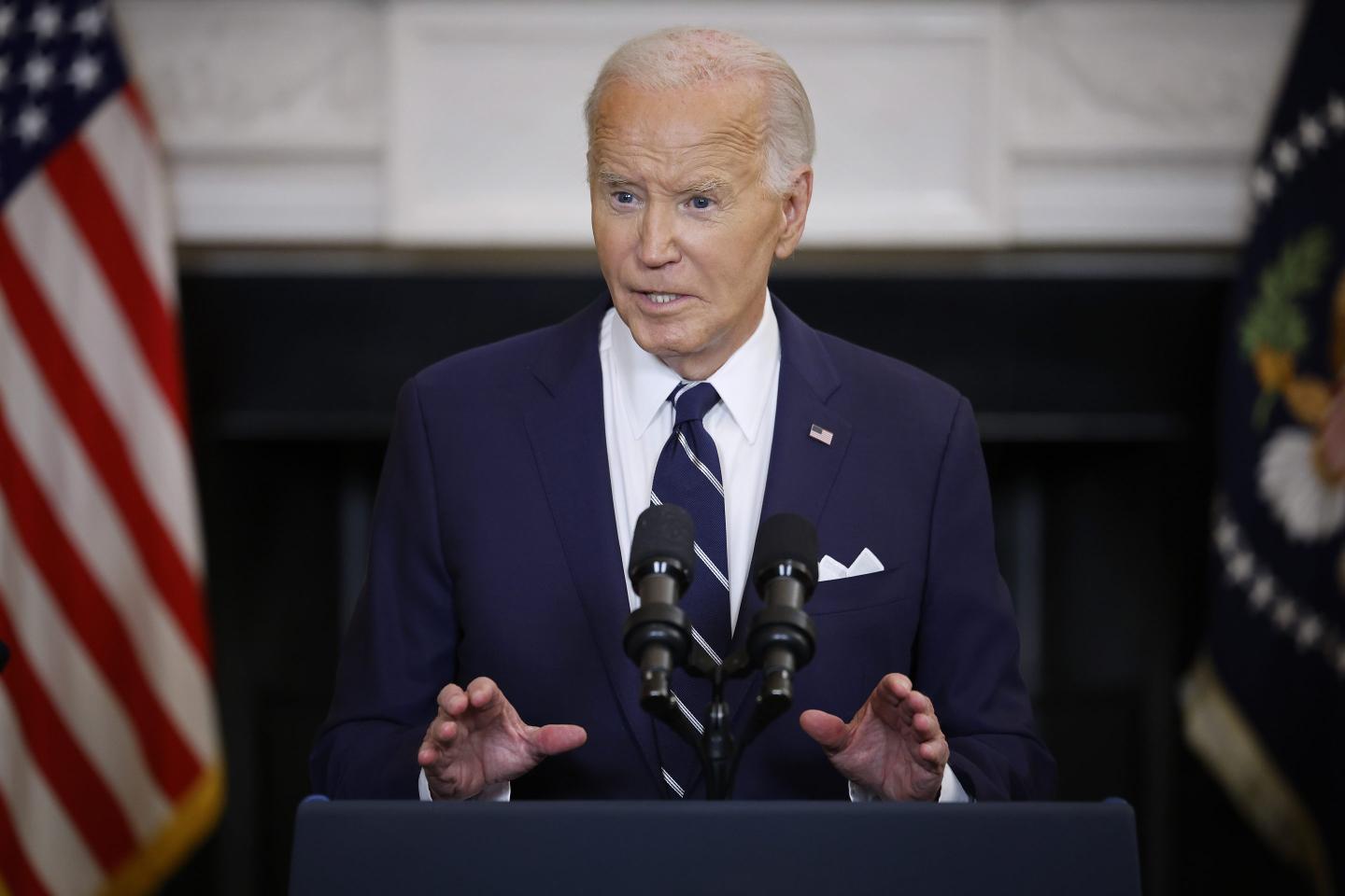 Joe Biden stands at podium